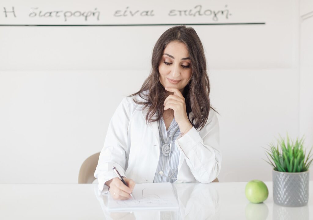 a doctor sitting and writing